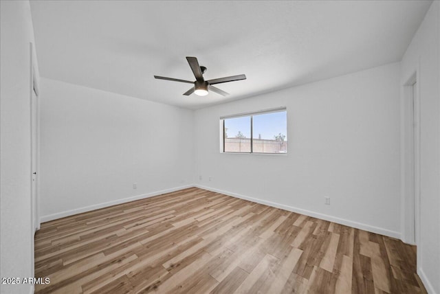 724 N Pine St, Gilbert, AZ 85233 - unfurnished room featuring ceiling fan, wood finished floors, and baseboards