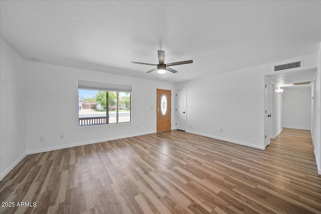724 N Pine St, Gilbert, AZ 85233 - unfurnished living room featuring wood finished floors, a ceiling fan, and baseboards