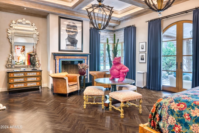 bedroom with ornamental molding, coffered ceiling, french doors, baseboards, and a chandelier