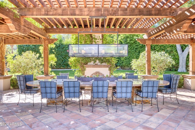 view of patio with a pergola, outdoor dining area, and an outdoor fireplace