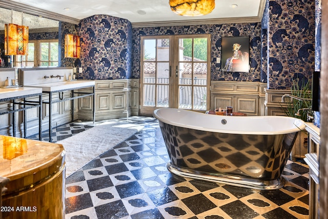 full bathroom featuring a wainscoted wall, wallpapered walls, crown molding, french doors, and tile patterned floors