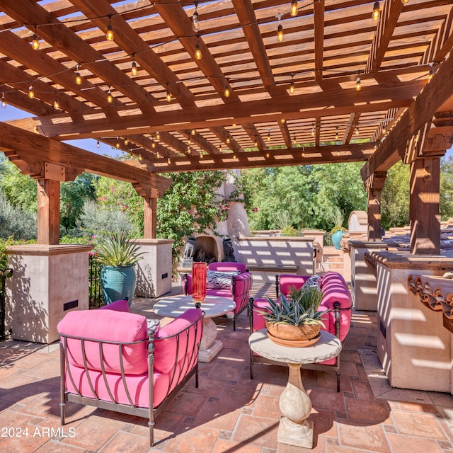 view of patio / terrace with an outdoor living space and a pergola