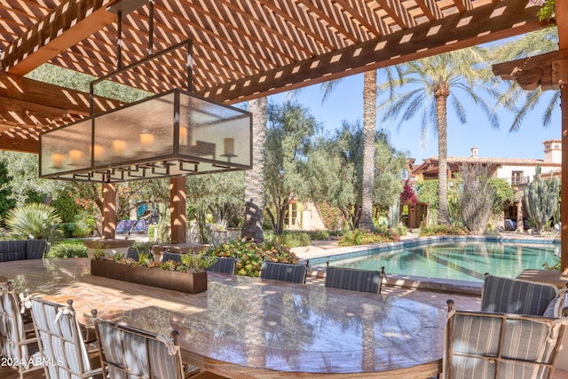 view of patio with outdoor dining area, an outdoor pool, and a pergola