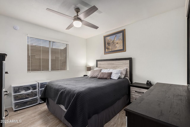 bedroom featuring a ceiling fan and light wood-type flooring