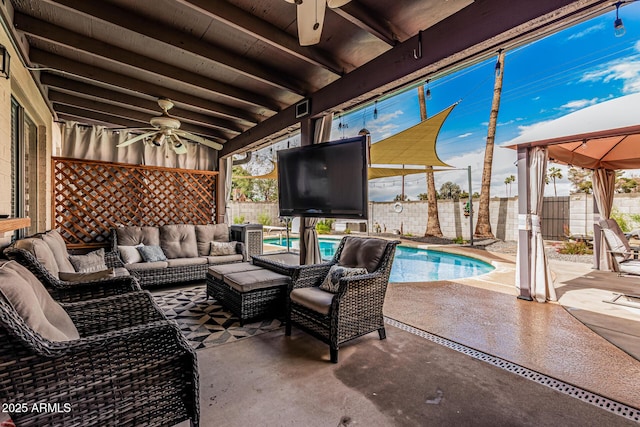 view of patio / terrace with an outdoor living space, a fenced backyard, a fenced in pool, and ceiling fan