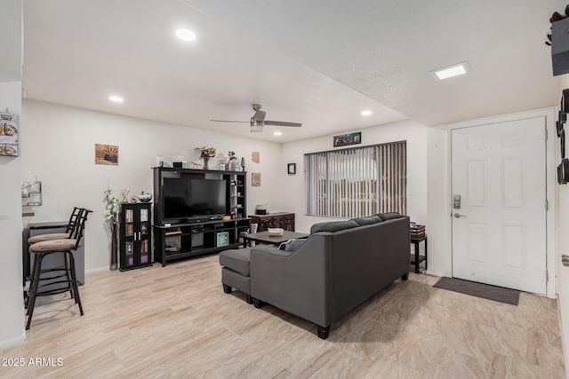 living area with recessed lighting and a ceiling fan