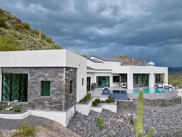 rear view of house with a patio