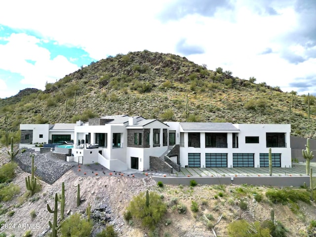 back of house with a mountain view