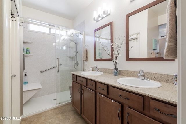 bathroom with vanity, tile patterned flooring, and a shower with door