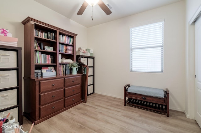 living area featuring ceiling fan and light wood-type flooring