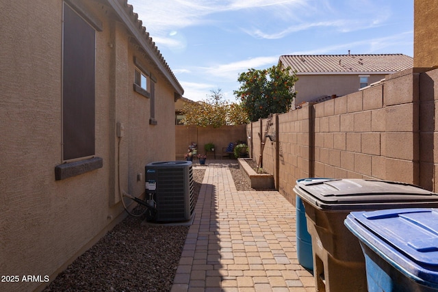 view of patio featuring a fenced backyard and central AC unit