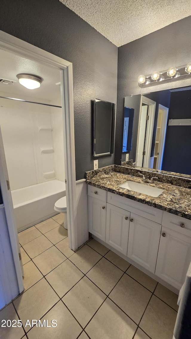 11026 N 28th Dr Unit 34, Phoenix, AZ 85029 - full bath with a textured wall, a textured ceiling, vanity, tile patterned flooring, and toilet