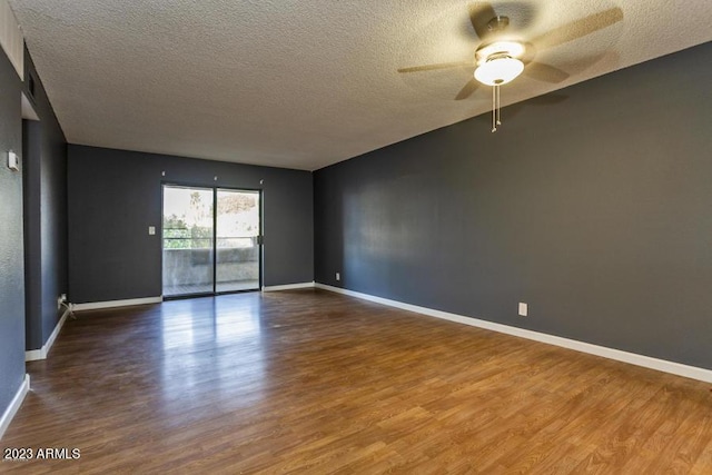 11026 N 28th Dr Unit 34, Phoenix, AZ 85029 - unfurnished room with a textured ceiling, wood finished floors, a ceiling fan, and baseboards