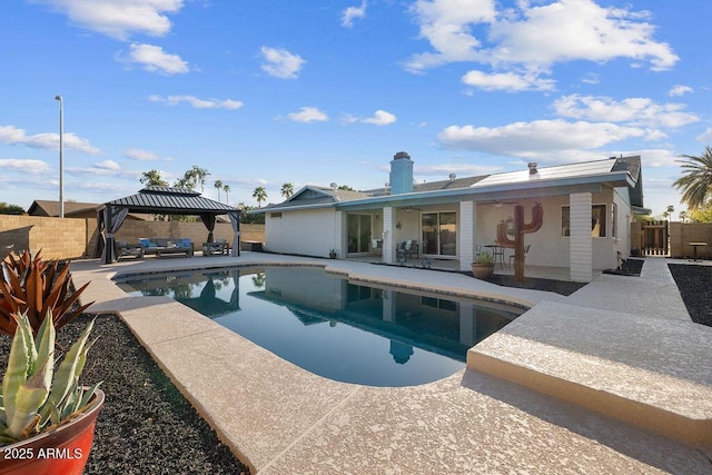 view of swimming pool with a gazebo, a fenced backyard, a fenced in pool, and a patio