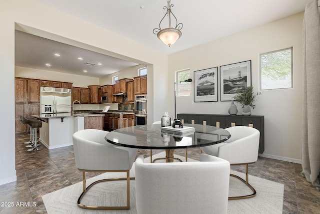 30374 N 124th Dr, Peoria, AZ 85383 - dining area with dark stone finish floors, baseboards, and recessed lighting