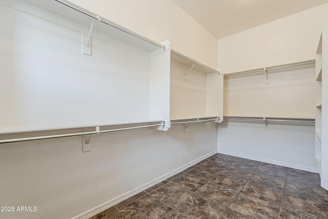 30374 N 124th Dr, Peoria, AZ 85383 - spacious closet featuring stone finish flooring