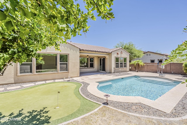 30374 N 124th Dr, Peoria, AZ 85383 - view of swimming pool with a putting area, a ceiling fan, a patio area, and a fenced backyard