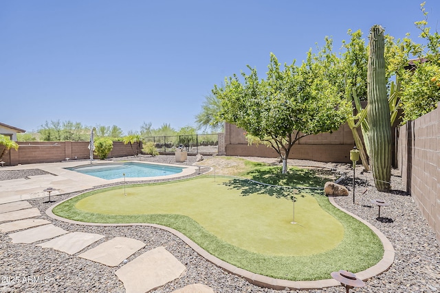 30374 N 124th Dr, Peoria, AZ 85383 - view of pool with a putting green and a fenced backyard
