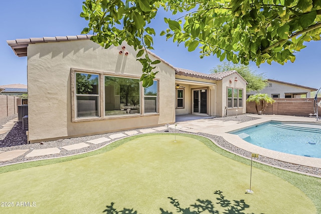 30374 N 124th Dr, Peoria, AZ 85383 - view of pool featuring a putting area, a fenced backyard, and a patio