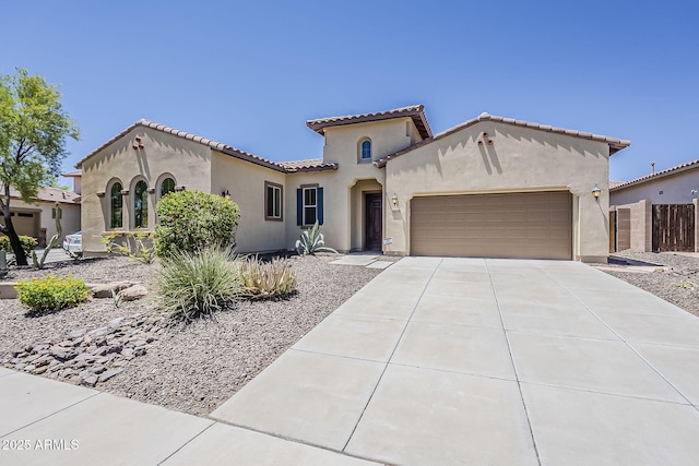 30374 N 124th Dr, Peoria, AZ 85383 - mediterranean / spanish home with an attached garage, stucco siding, concrete driveway, and a tiled roof