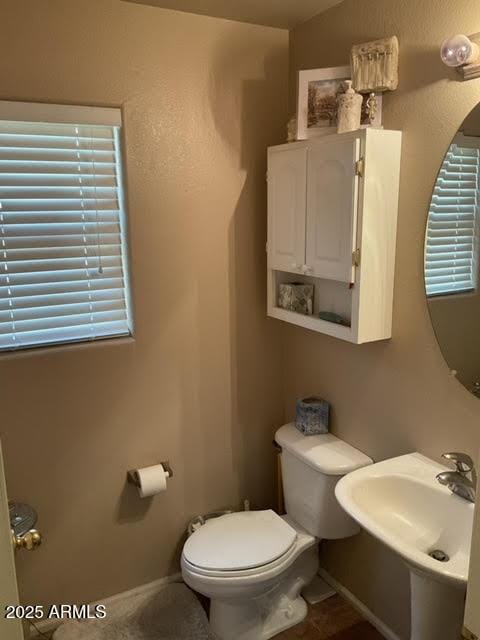 bathroom featuring sink and toilet