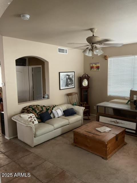 living room featuring ceiling fan