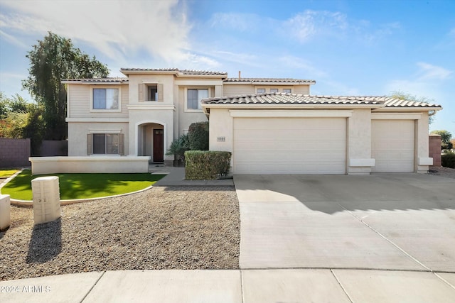 mediterranean / spanish-style home featuring a garage