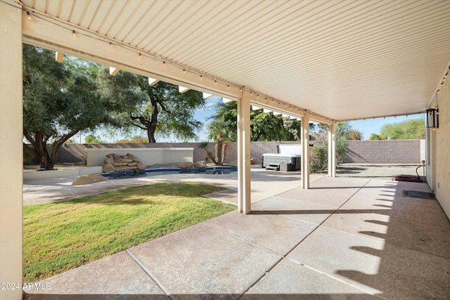 view of patio / terrace with a hot tub