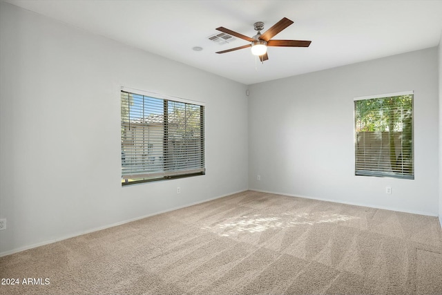 carpeted empty room with ceiling fan