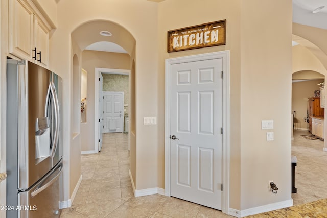 hallway featuring light tile patterned floors