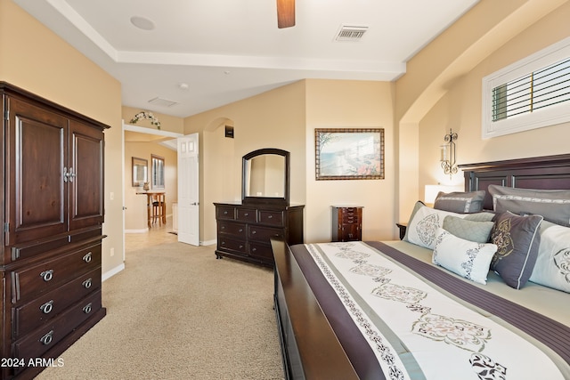 bedroom with ceiling fan and light carpet