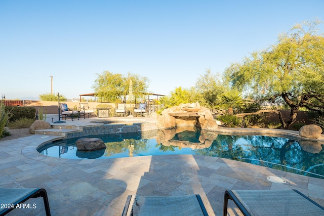 view of swimming pool featuring a patio area