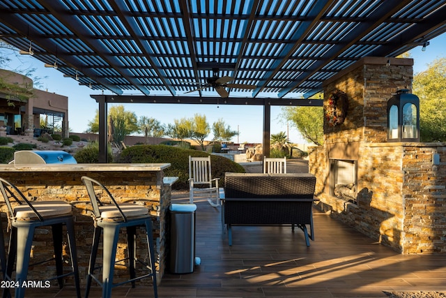 deck featuring a pergola and exterior bar