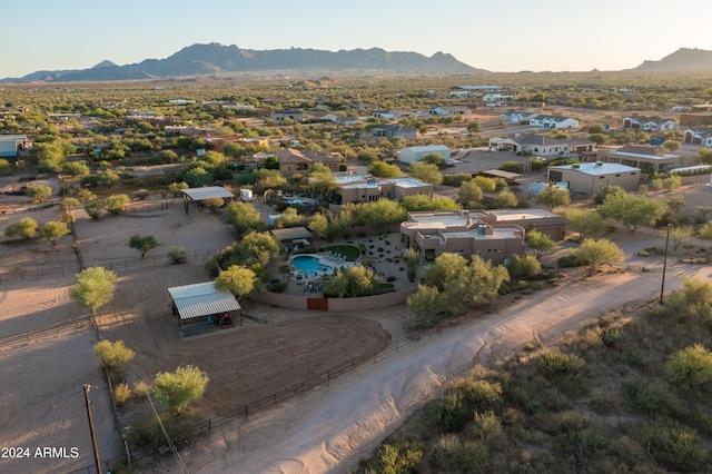 birds eye view of property with a mountain view