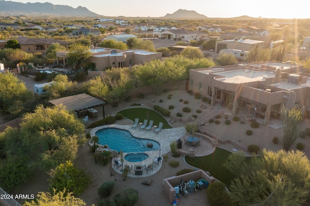 birds eye view of property featuring a mountain view