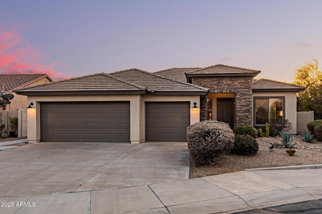 prairie-style house featuring a garage