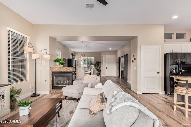 living room featuring hardwood / wood-style flooring and a barn door