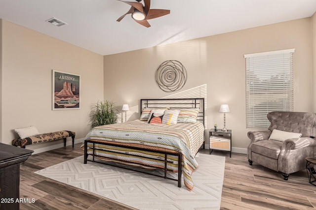 bedroom with hardwood / wood-style flooring and ceiling fan