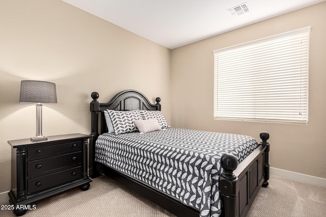 carpeted bedroom featuring multiple windows