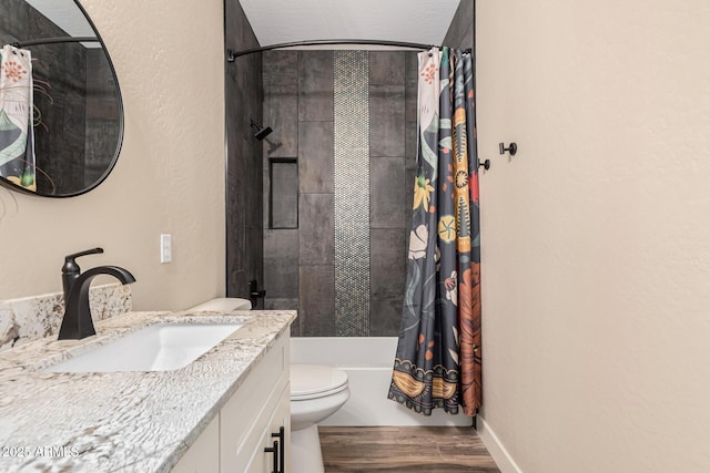 full bathroom with wood-type flooring, toilet, shower / tub combo, and vanity