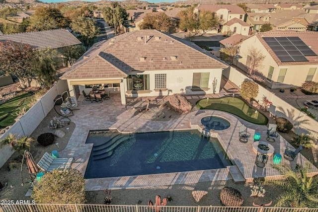 view of swimming pool with a patio and an in ground hot tub