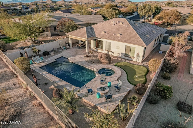 view of swimming pool with an in ground hot tub and a patio area