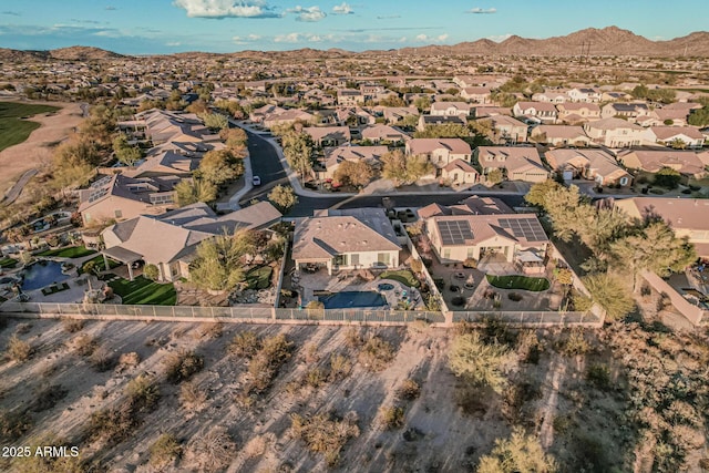 birds eye view of property with a mountain view