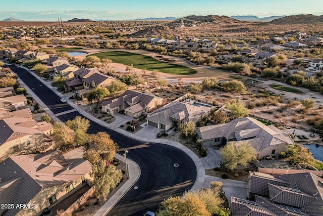 birds eye view of property featuring a mountain view