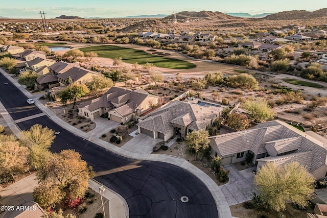 birds eye view of property featuring a mountain view