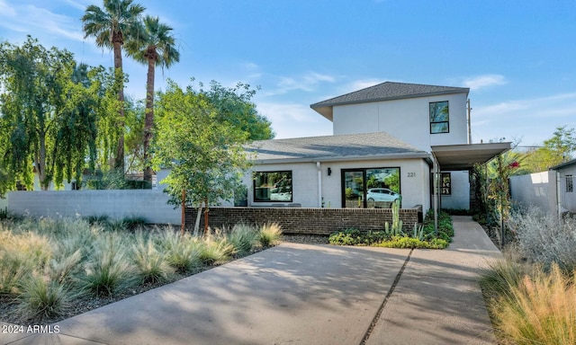 view of front of property featuring a carport