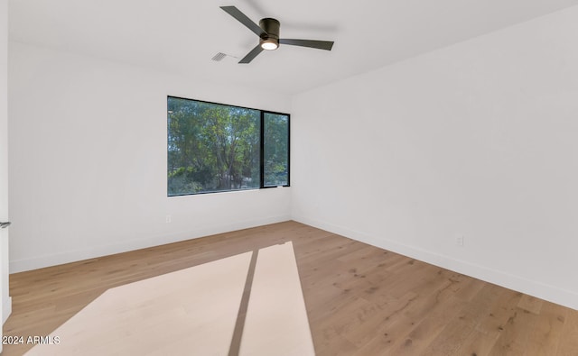 unfurnished room featuring ceiling fan and light wood-type flooring