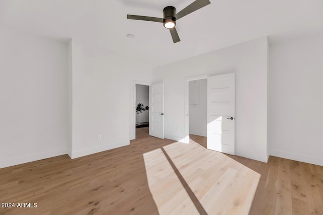 unfurnished bedroom featuring light wood-type flooring and ceiling fan