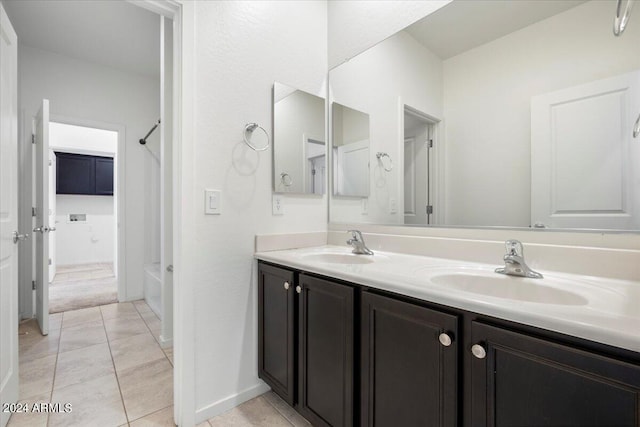 bathroom featuring double vanity,  shower combination, and tile patterned floors