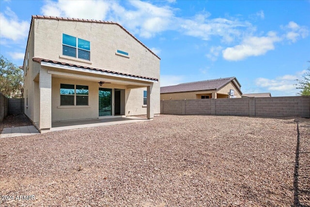 back of house with a patio area